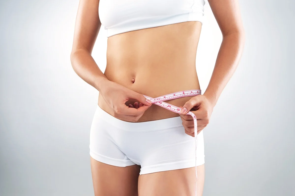 Hormonal weight gain affecting abdominal fat around the waist